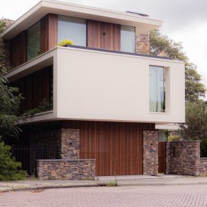a large white building with wooden doors and windows